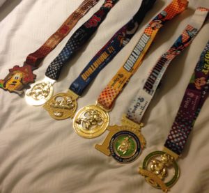 lots of disney medals! Dopey Challenge Walt Disney World