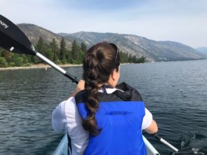 Kelly from Our Adventure Journal kayaking at lake chelan