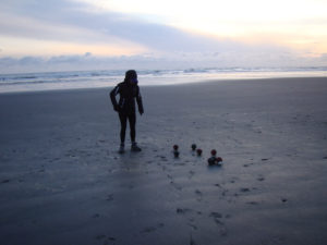 Kelly from Our Adventure Journal Playing bocce ball at the beach Kalaloch