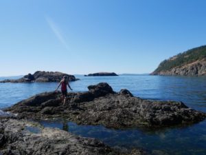 Kelly from Our Adventure Journal at Deception Pass in Washington State