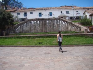 Kelly from Our Adventure Journal at the Plaza San Blas looking at a fountain