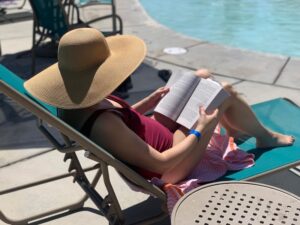 Kelly from Our Adventure Journal reading a book at WorldMark Indio 