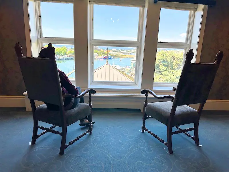 Chairs by the elevator overlooking the water at the Fairmont Empress Hotel